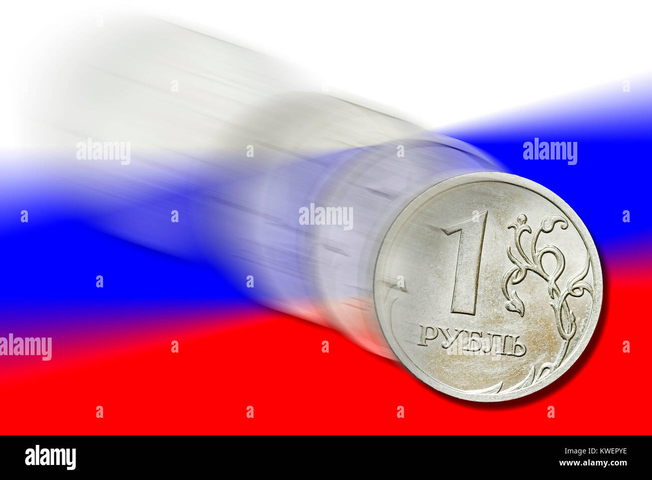 One-rouble coin before Russian flag in the fall flight, depreciation of the rouble, Ein-Rubel-M?nze vor russischer Fahne im Sturzflug, Wertverlust des Stock Photo
