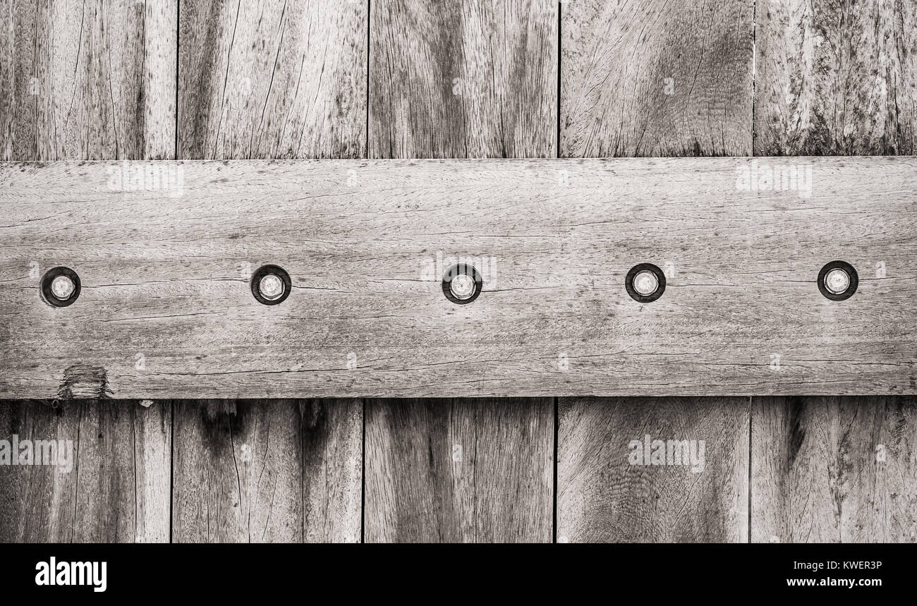 Wooden panels with bolts background Stock Photo