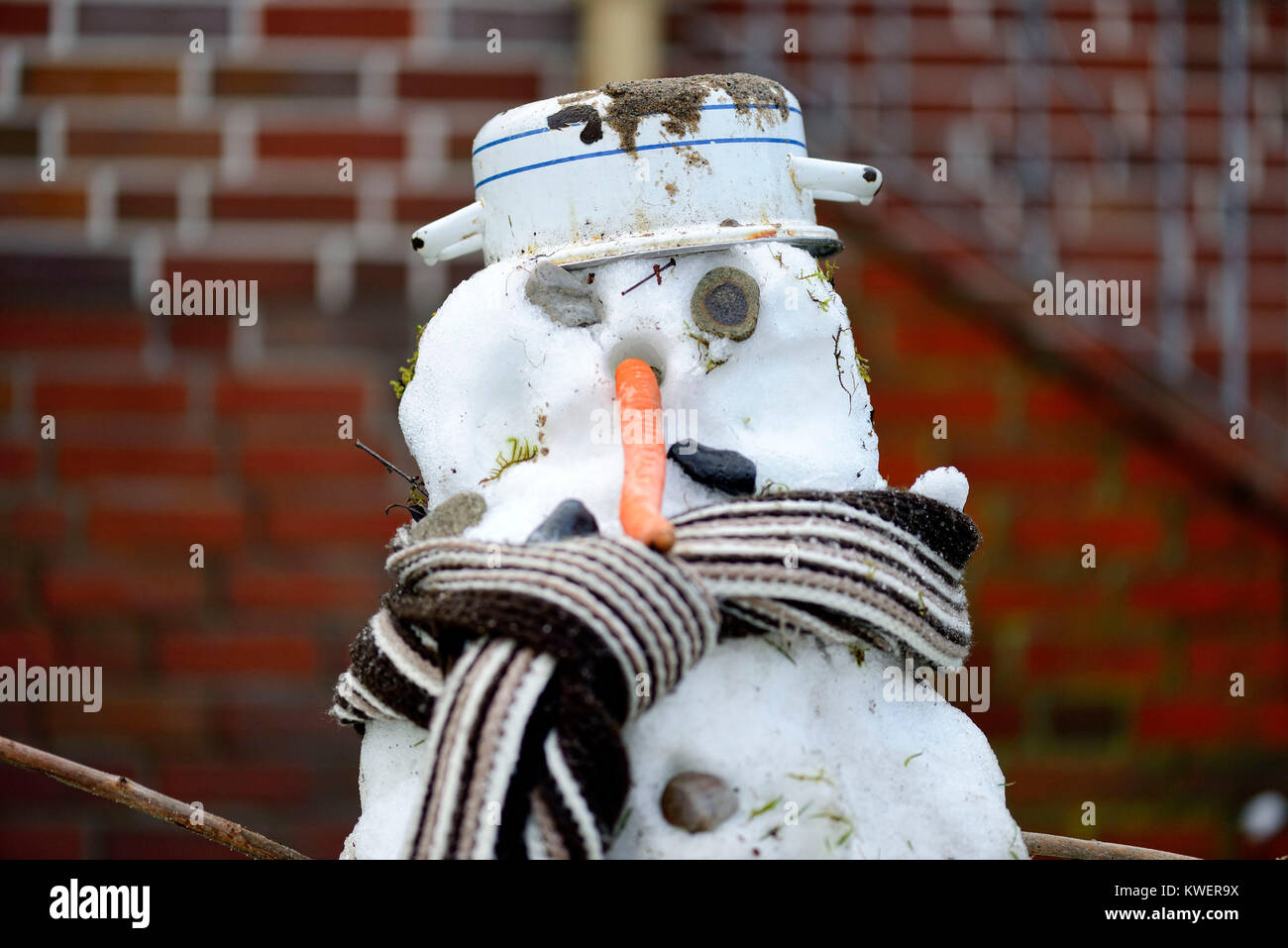 Fierce snowman in Hamburg, mild winter, Grimmiger Schneemann in Hamburg, milder Winter Stock Photo
