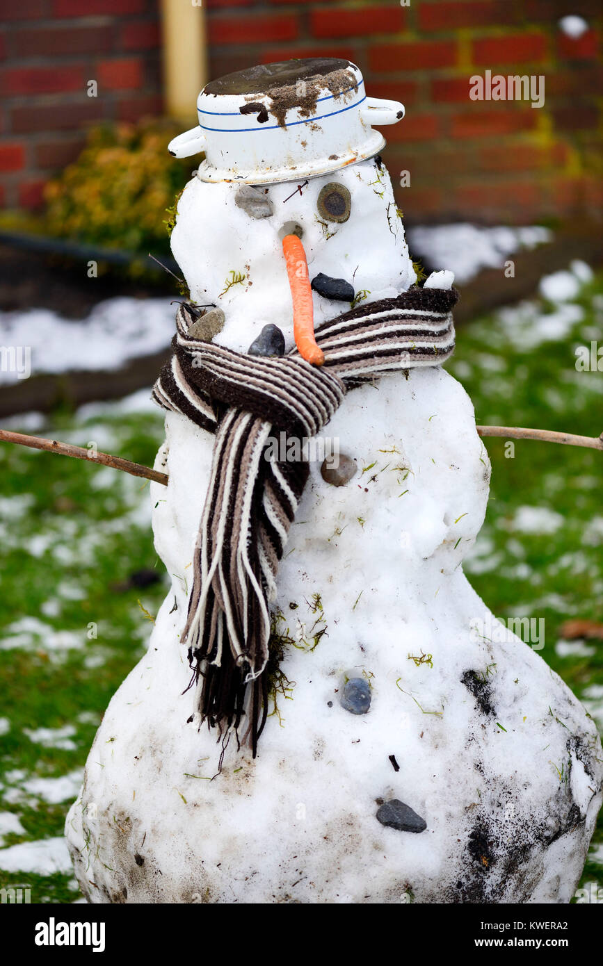 Fierce snowman in Hamburg, mild winter, Grimmiger Schneemann in Hamburg, milder Winter Stock Photo