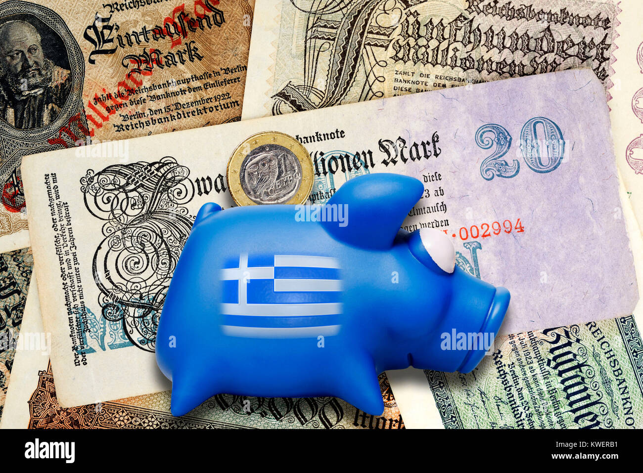 Old German inflation bank notes and Greek piggy bank, Greek Reparationsforderungen, Alte deutsche Inflations-Geldscheine und griechische Sparschwein,  Stock Photo
