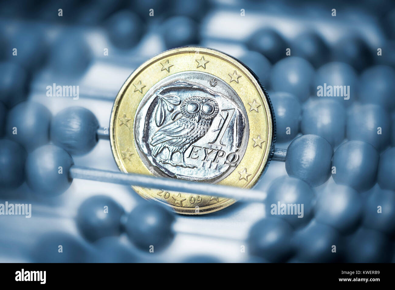 Greek euro-coin one and slide rule, Greek Reparationsforderungen, Griechische Ein-Euro-Muenze und Rechenschieber, griechische Reparationsforderungen Stock Photo