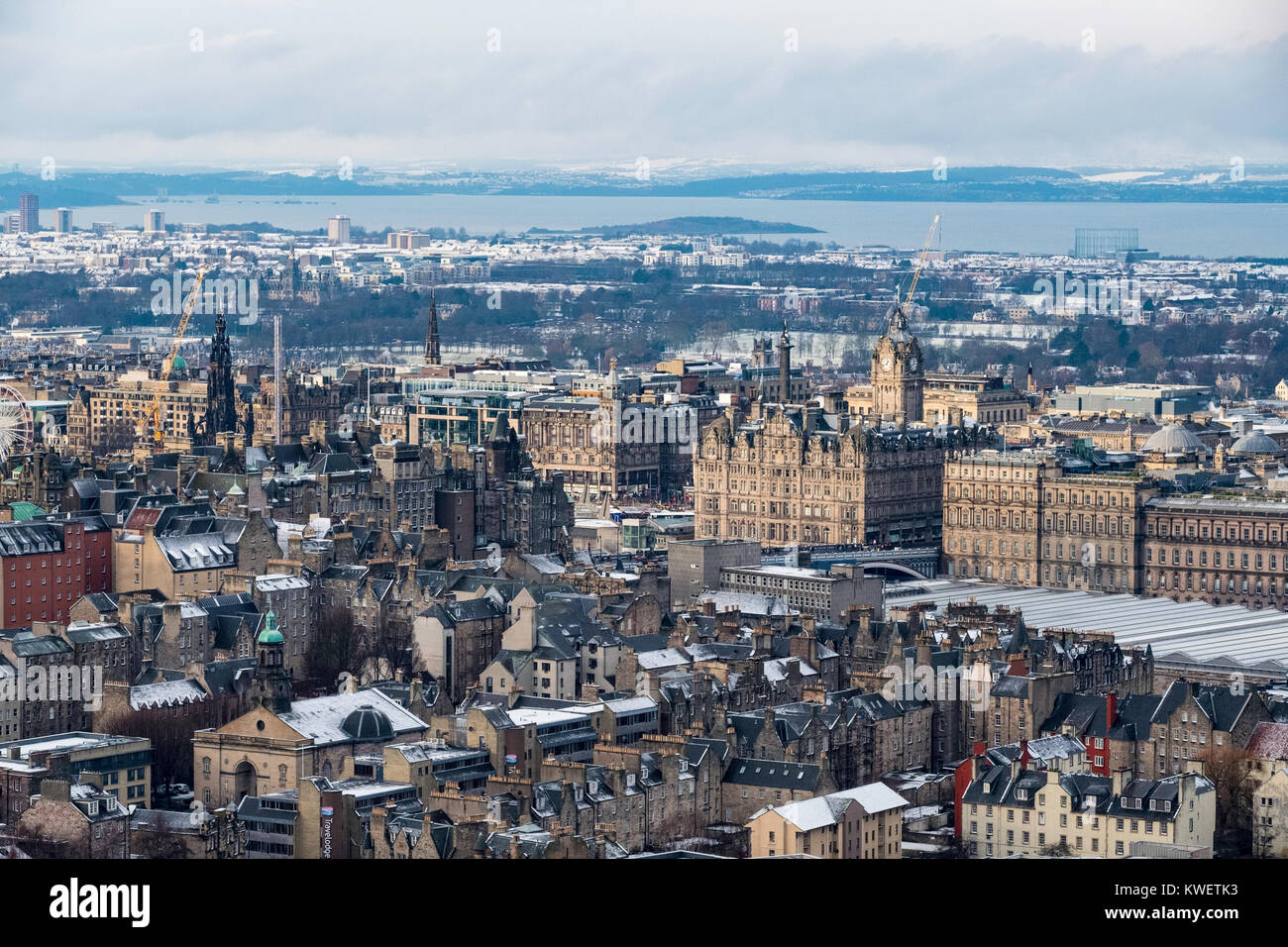 View over city centre of Edinburgh during winter after a snowfall, Scotland, United Kingdom. Stock Photo