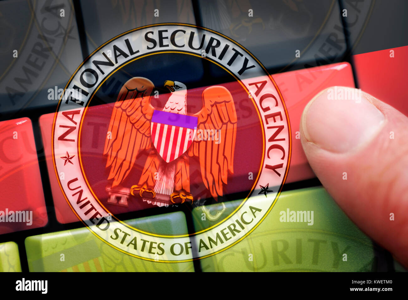 Finger on computer keyboard in German national colours and NSA signs, symbolic photo Federal Intelligence Service scandal, Finger auf Computertastatur Stock Photo