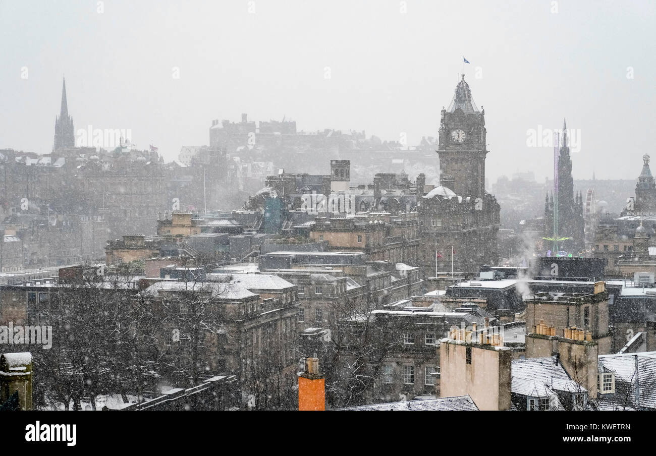 Edinburgh Snowfall Snow falls on city of Edinburgh in December. Skyline view of city from ...