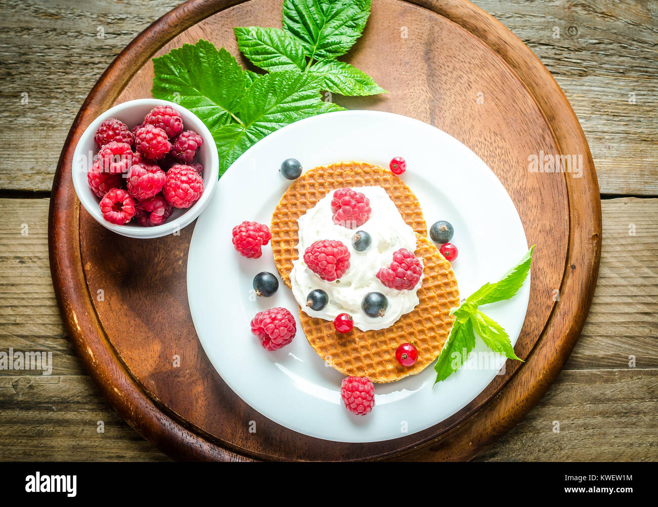 Belgian waffles with whipped cream and fresh berries Stock Photo - Alamy