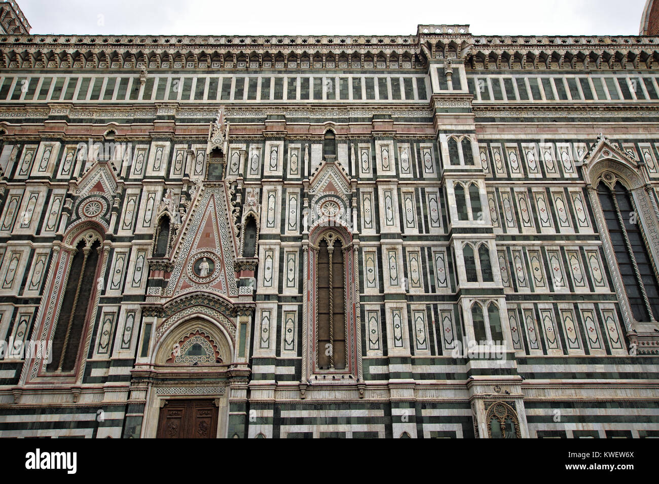 FLORENCE, ITALY: Gothic exterior of Santa Maria del Fiore Cathedral, the geometric patterning  made from encrusted marble Stock Photo