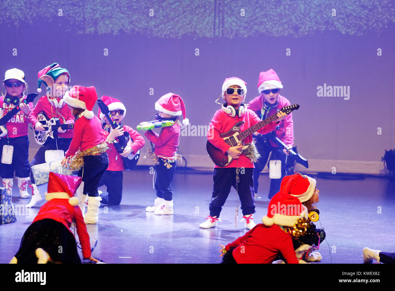 Three and four year olds singing and dancing, giving their christmas show Stock Photo