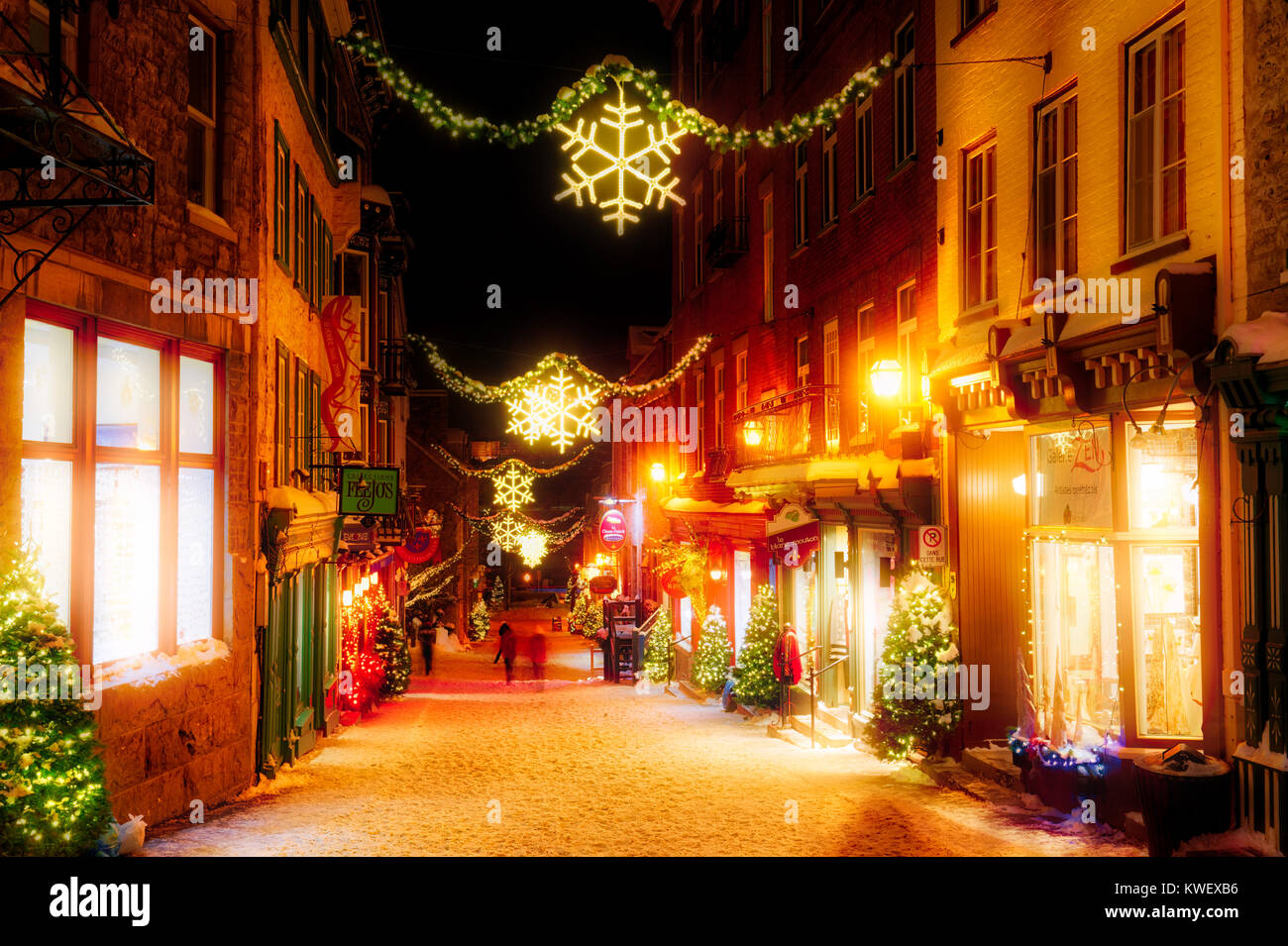 Christmas decorations and fresh snow in Quebec City's Petit Champlain area at night in Rue Sous