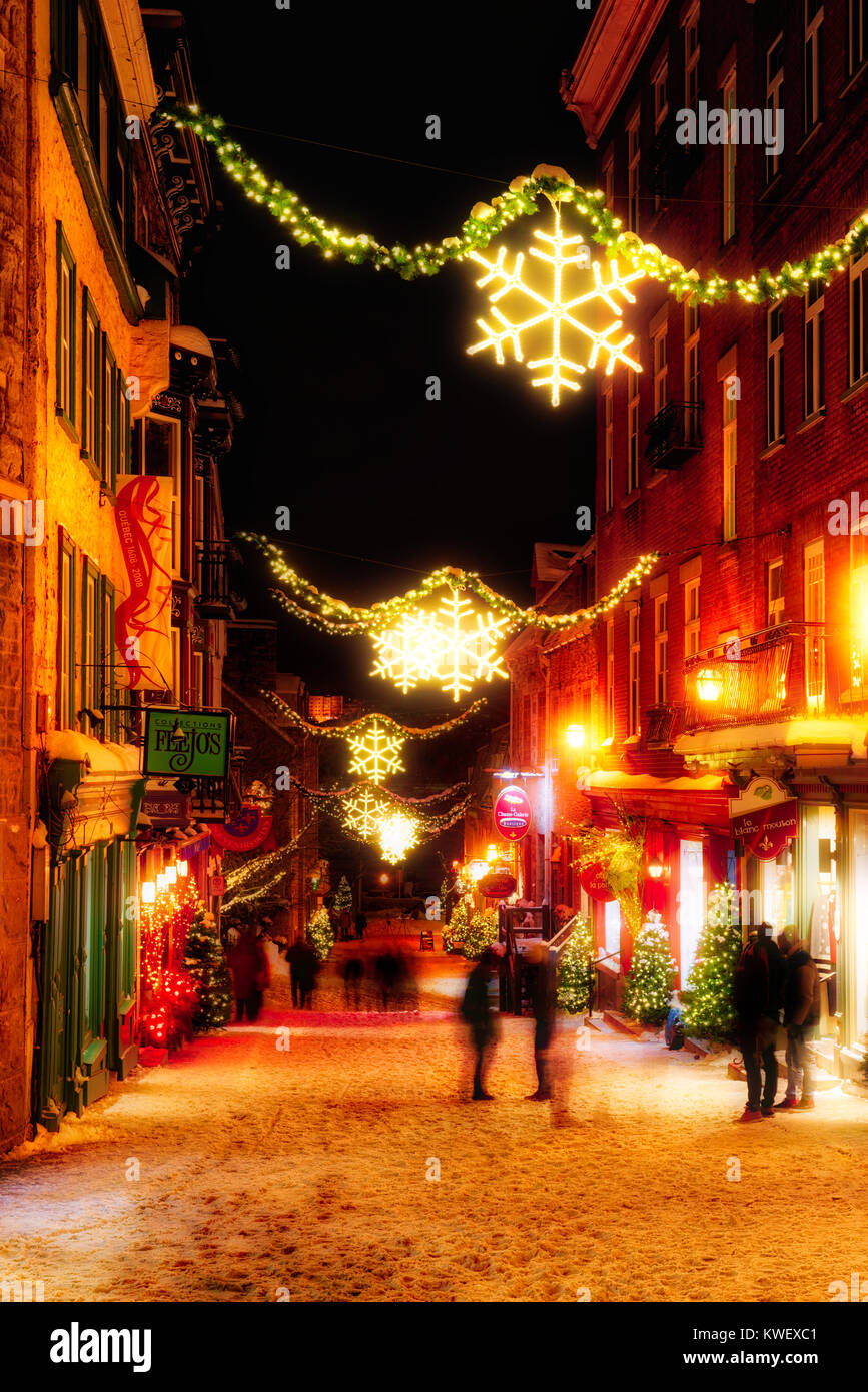 Christmas decorations and fresh snow in Quebec City's Petit Champlain area at night in Rue Petit Champlain Stock Photo