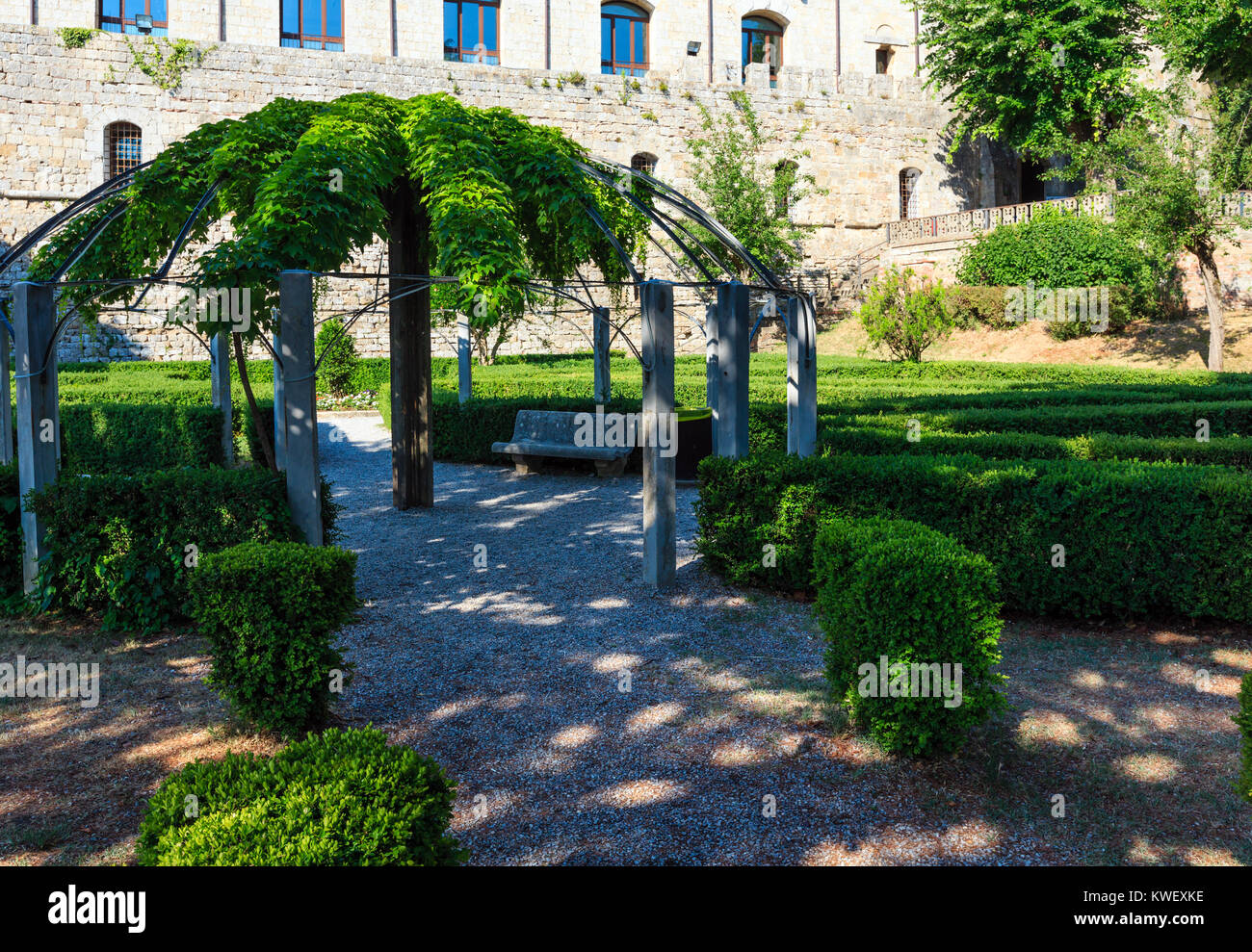 Green garden with geometric shades near Montepulciano Fortezza Medicea (Fortezza Di Montepulciano). Province of Siena, Tuscany, Italy. Stock Photo