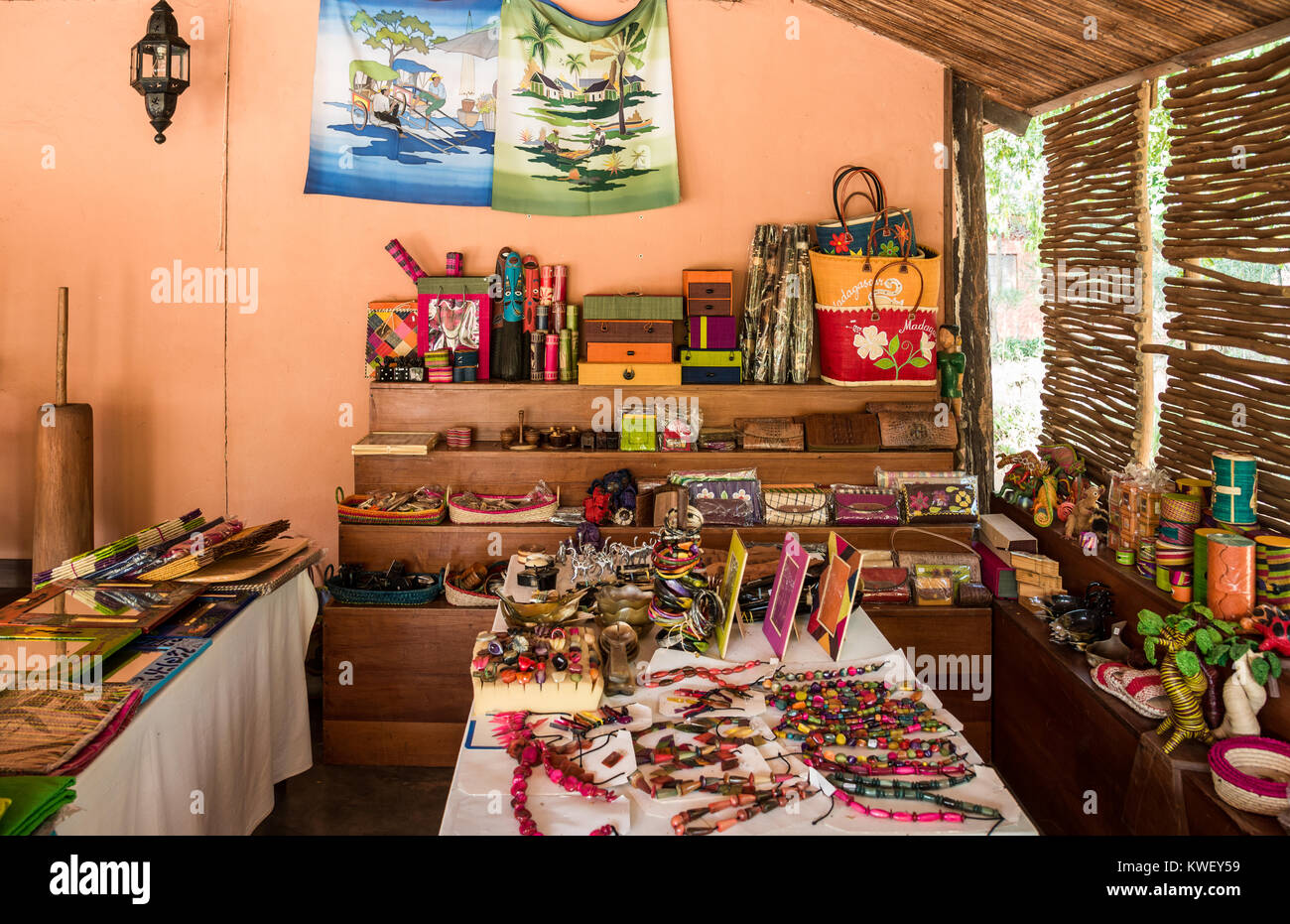 Tables and shelves filled with local handy craft souvenirs. Berenty Private Reserve. Madagascar, Africa. Stock Photo