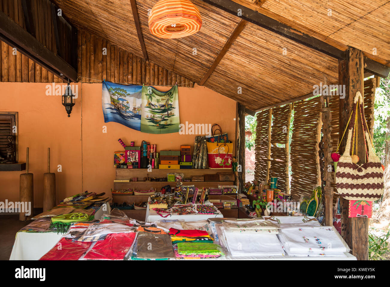 Tables and shelves filled with local handy craft souvenirs. Berenty Private Reserve. Madagascar, Africa. Stock Photo