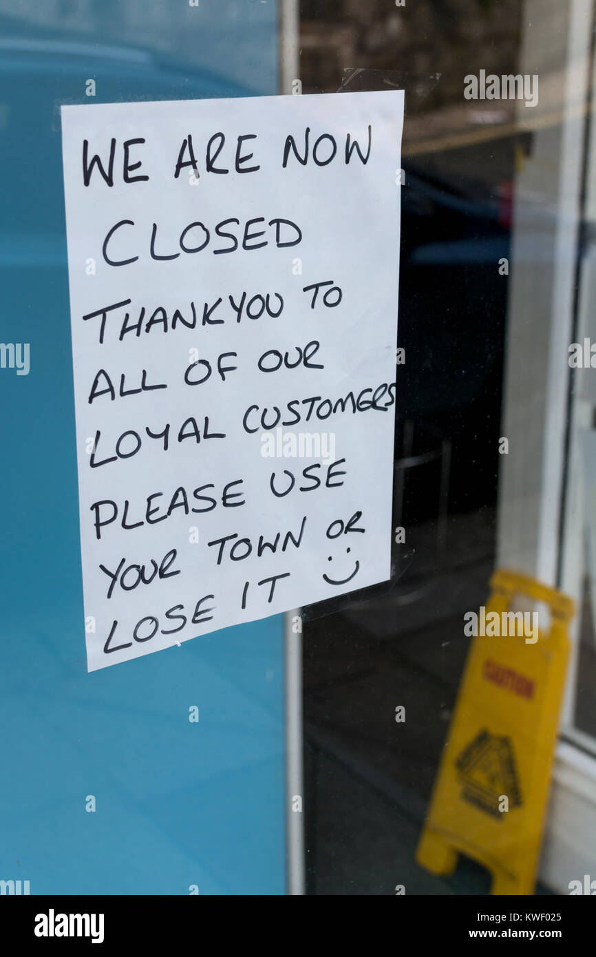 Window sign in high street shop after closing down Metaphor recession, struggling high street, high street crisis, closed for business, shut down shop Stock Photo