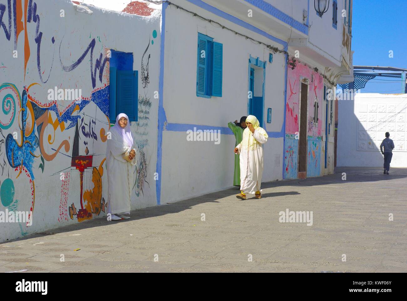 Women in the streets of Asilah, an old town in Morocco, situated at the Atlantic Ocean Stock Photo