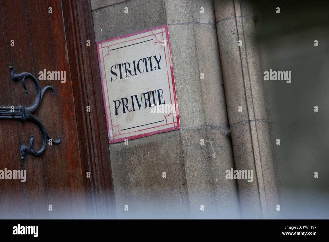 A Strictly Private sign photographed behind cast iron gates in London, UK. Stock Photo