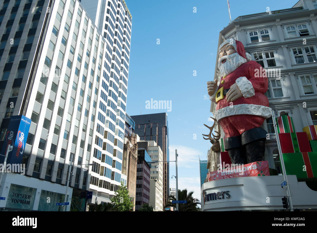 A giant santa figure in front of Farmers store in Auckland, New Zealand Stock Photo