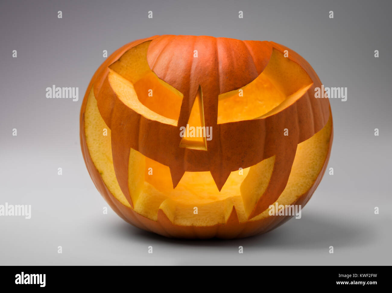 Halloween pumpkin on grey gradient background Stock Photo - Alamy