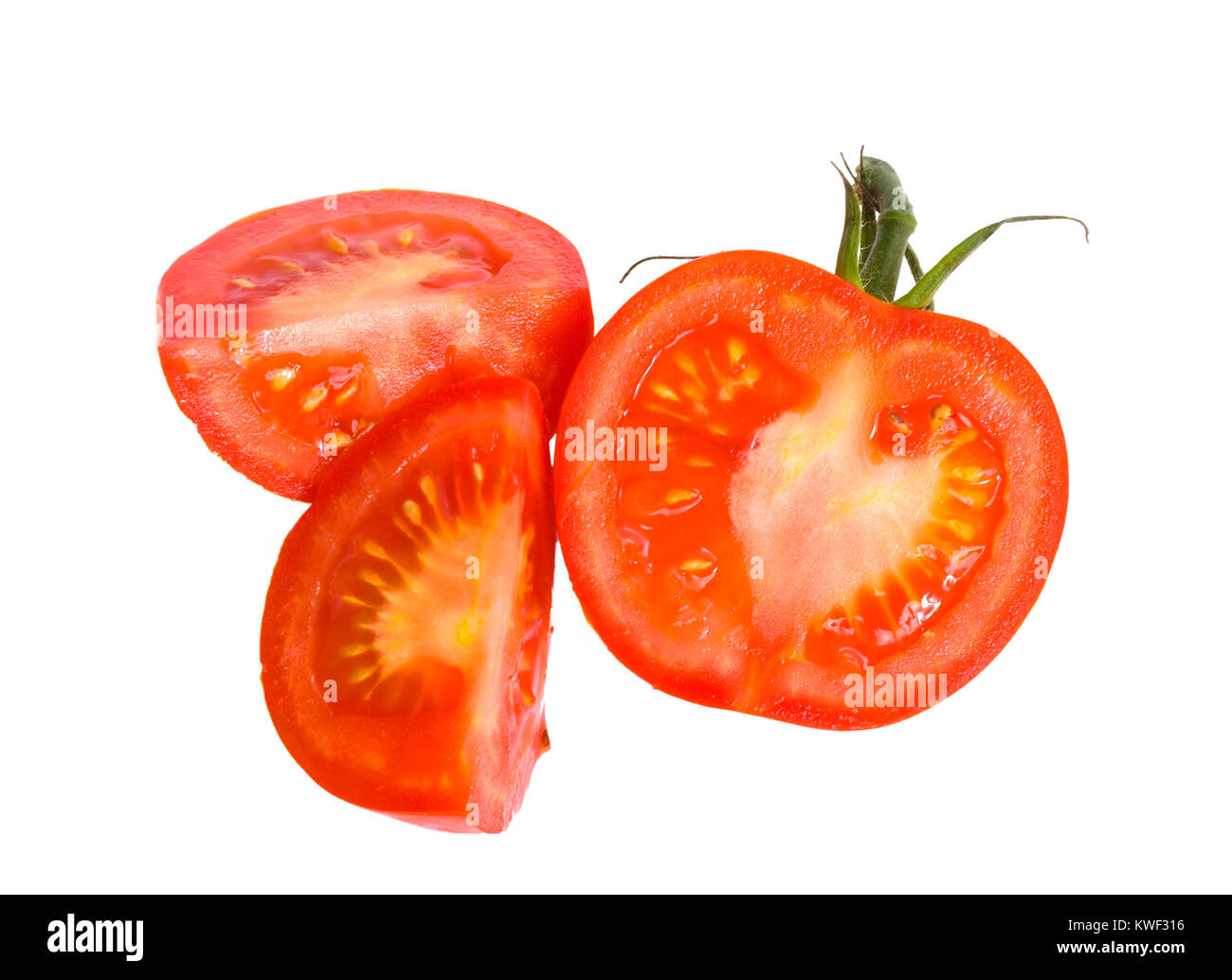 Sliced Ripe Tomatoe segments isolated on white Stock Photo