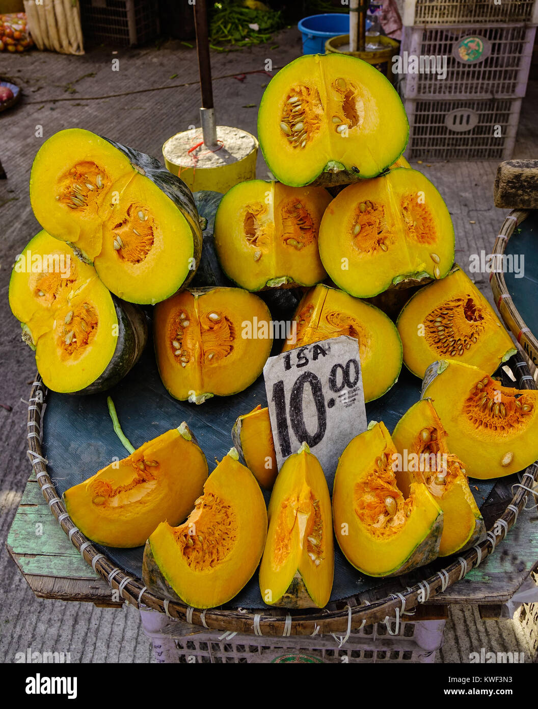 Slice of yellow pumpkin at rural market in Manila, Philippines Stock ...