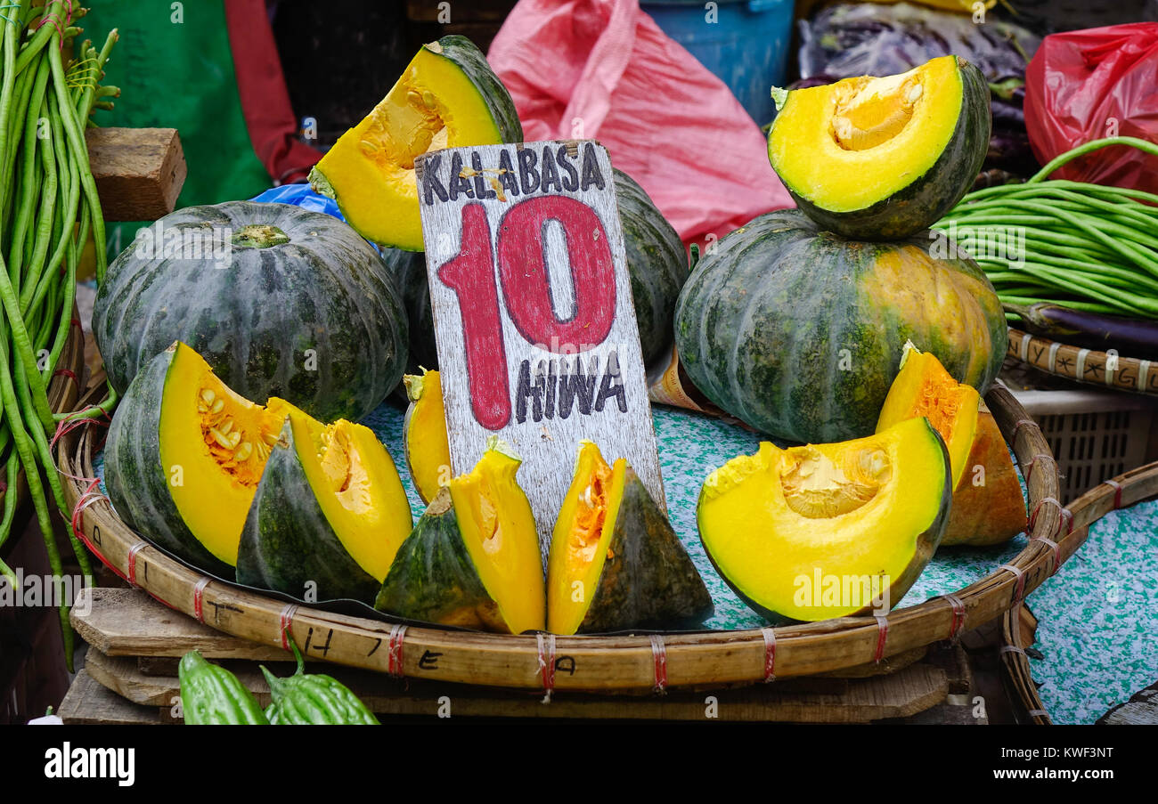 Slice of yellow pumpkin at street market in Manila, Philippines Stock ...