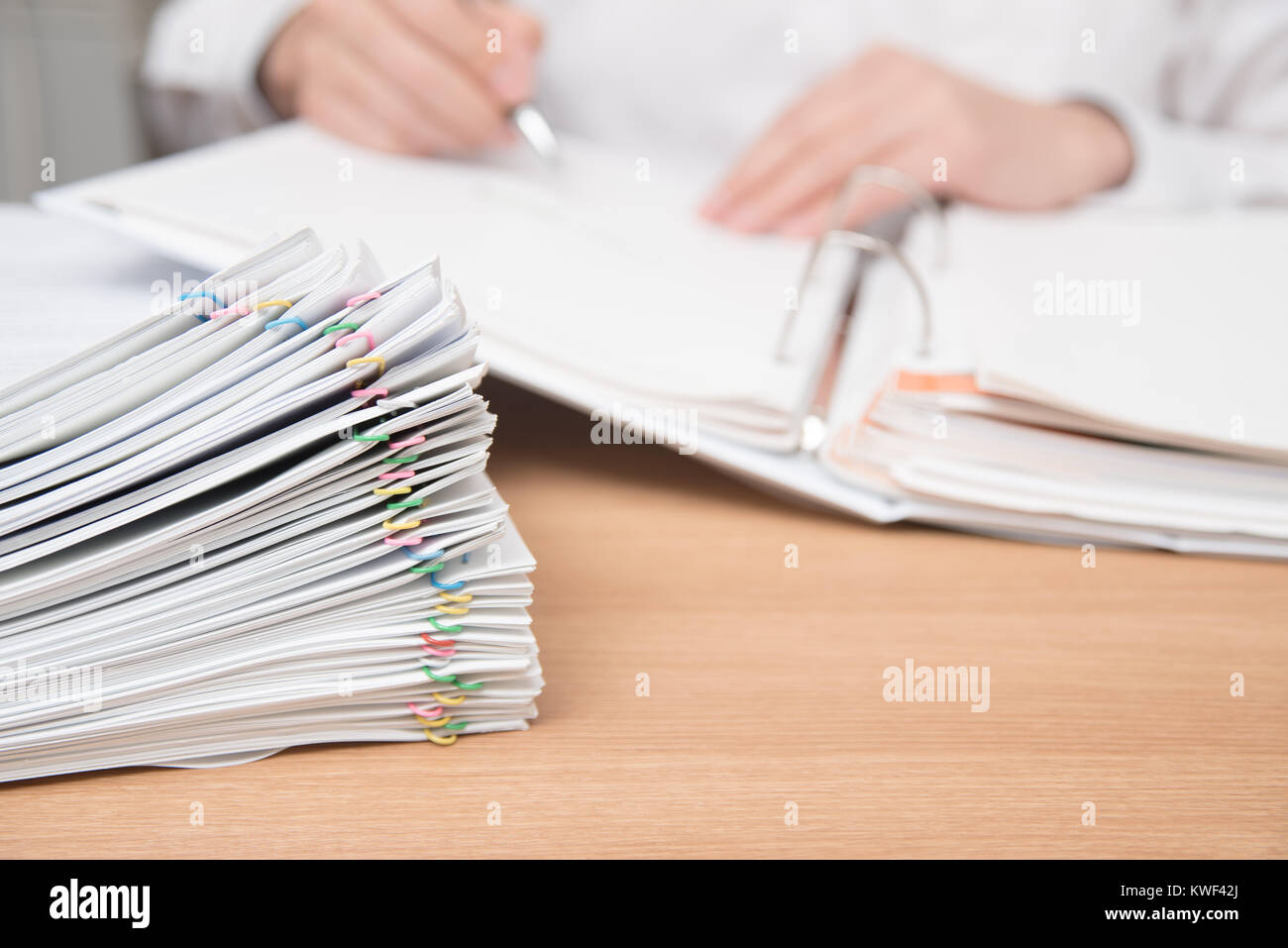A pile of documents with the man in the document Stock Photo