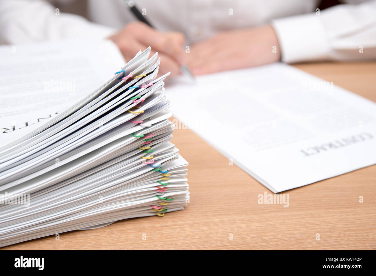 A pile of documents with the man in the document Stock Photo