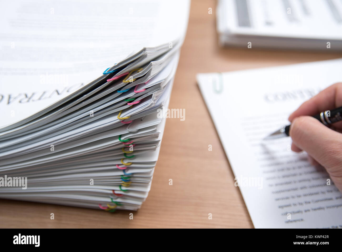 A pile of documents with the man in the document Stock Photo