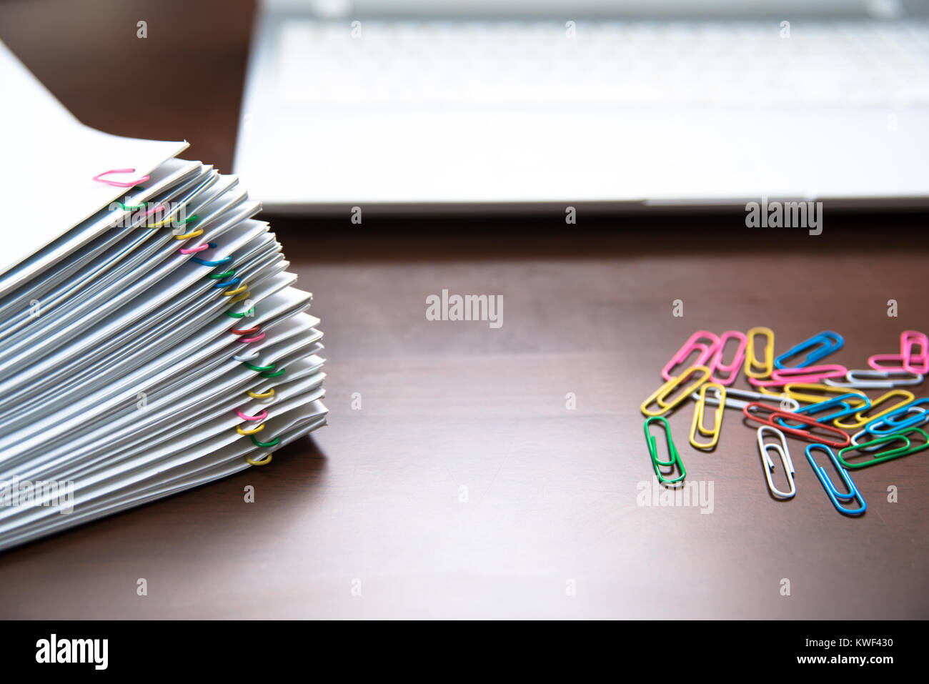 Pile of paper with colorful clips Stock Photo