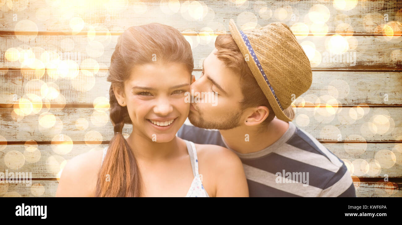 Composite image of man kissing woman Stock Photo - Alamy