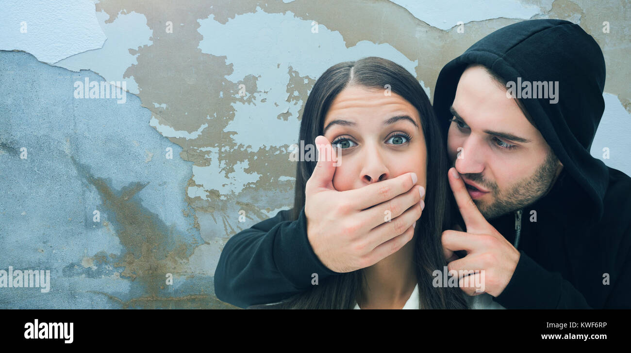 Composite image of woman being attacked by scary man Stock Photo