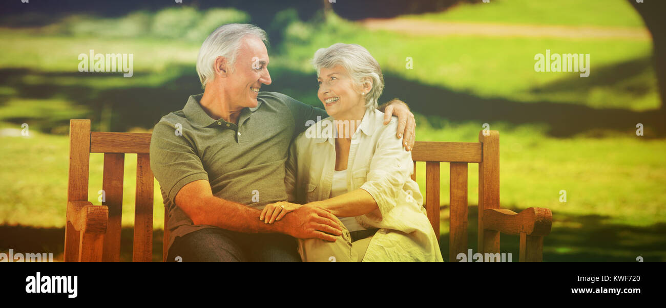Senior couple sitting on a bench Stock Photo