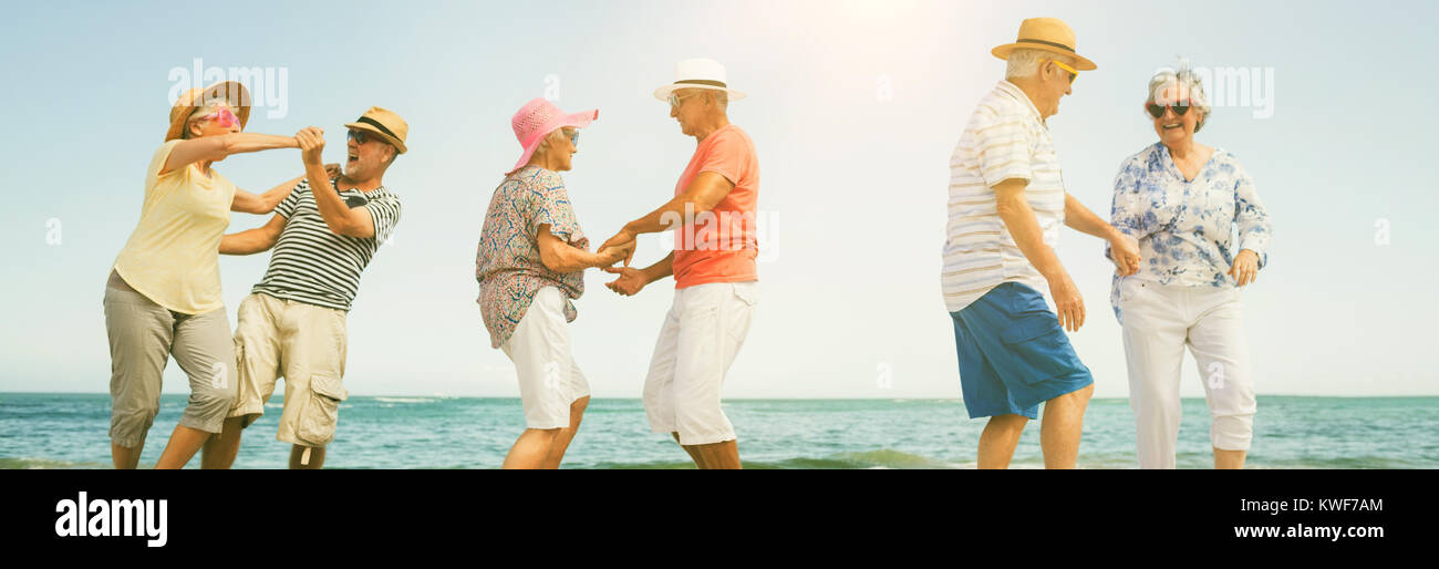 Happy senior couples dancing Stock Photo