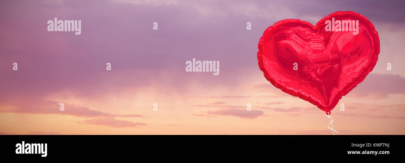 Composite image of red heart balloon Stock Photo