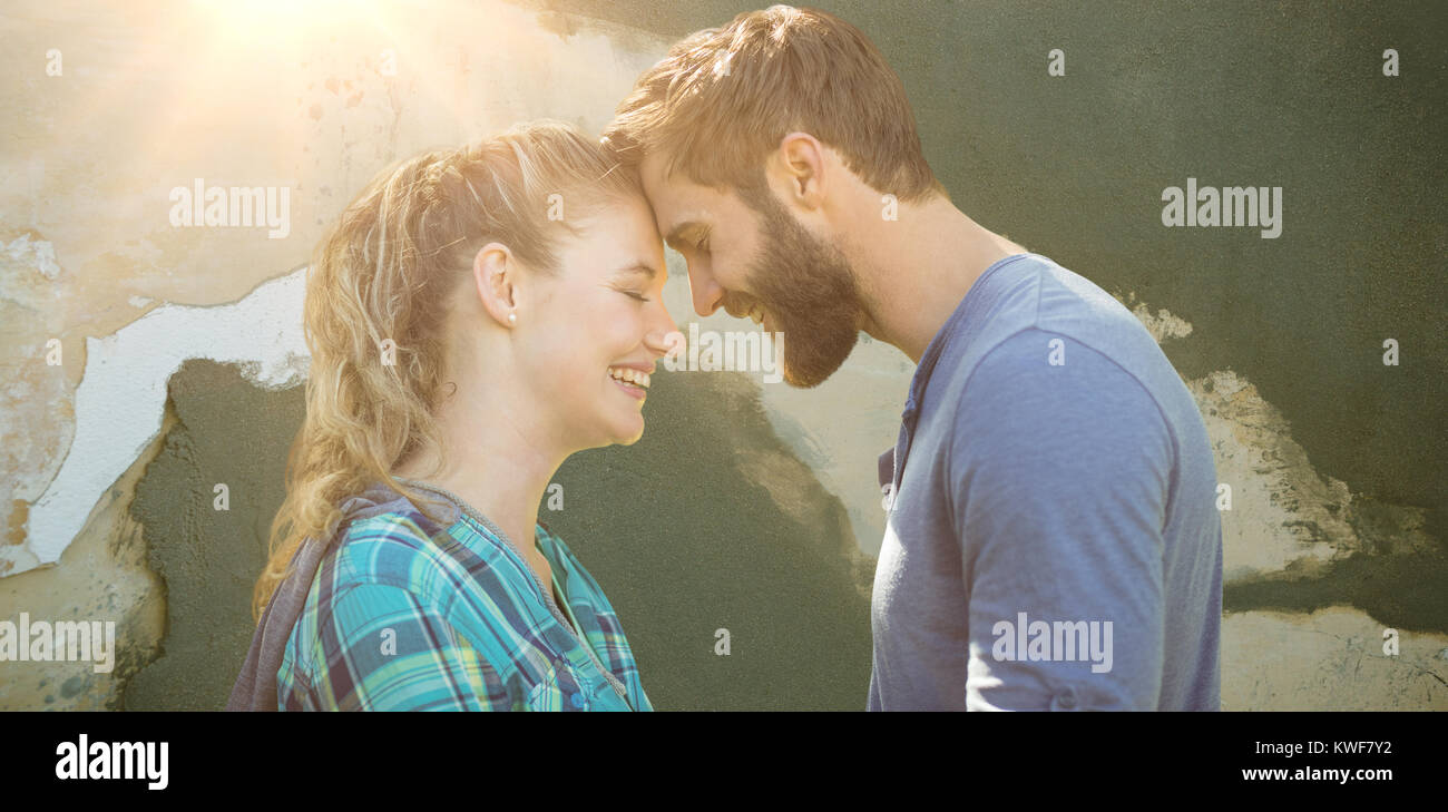 Composite image of couple smiling with close eyes Stock Photo