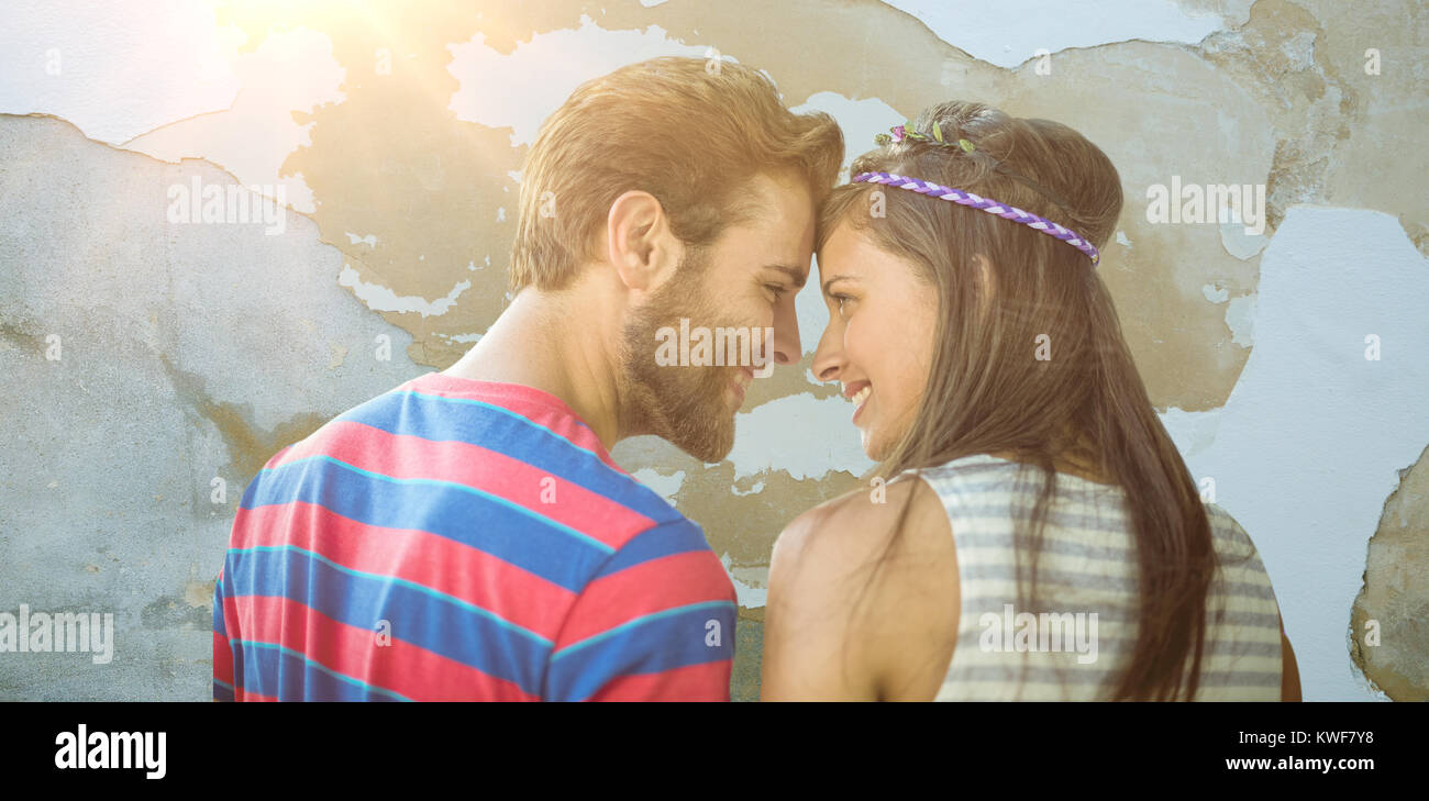 Composite image of happy young couple standing Stock Photo