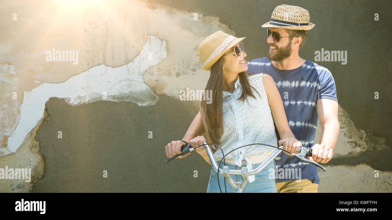 Composite image of man and woman cycling Stock Photo