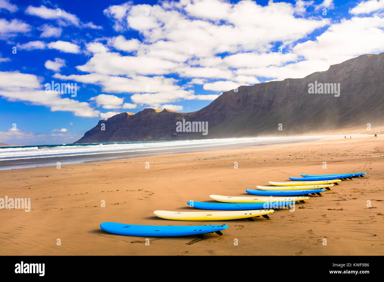 Impressive Famara beach,view with sea,surf and mountains,Lanzarote island,Canary,Spain. Stock Photo