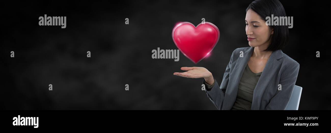 Woman with open hand and heart Stock Photo