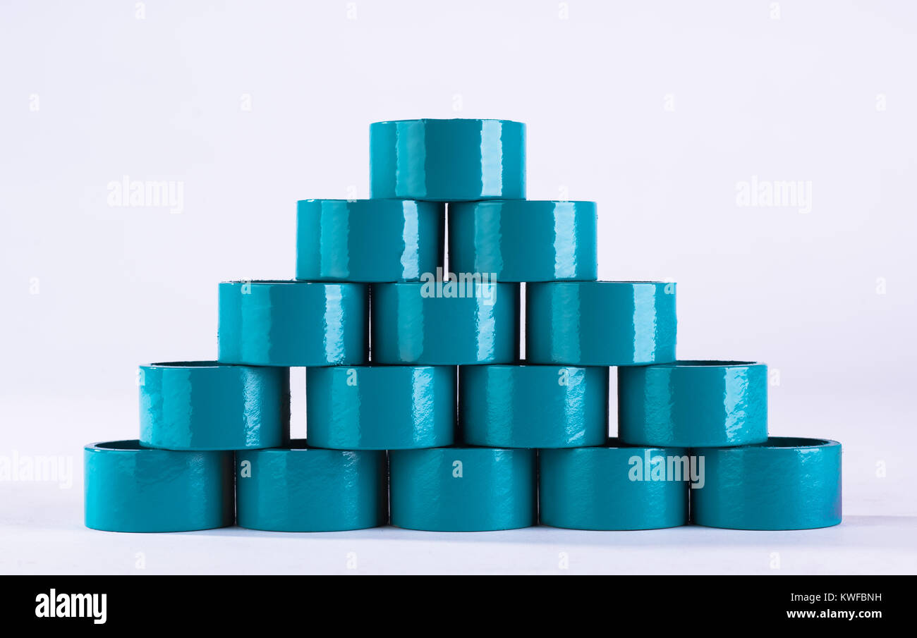 Round turquoise colored rings, arranged in pyramid shape Stock Photo