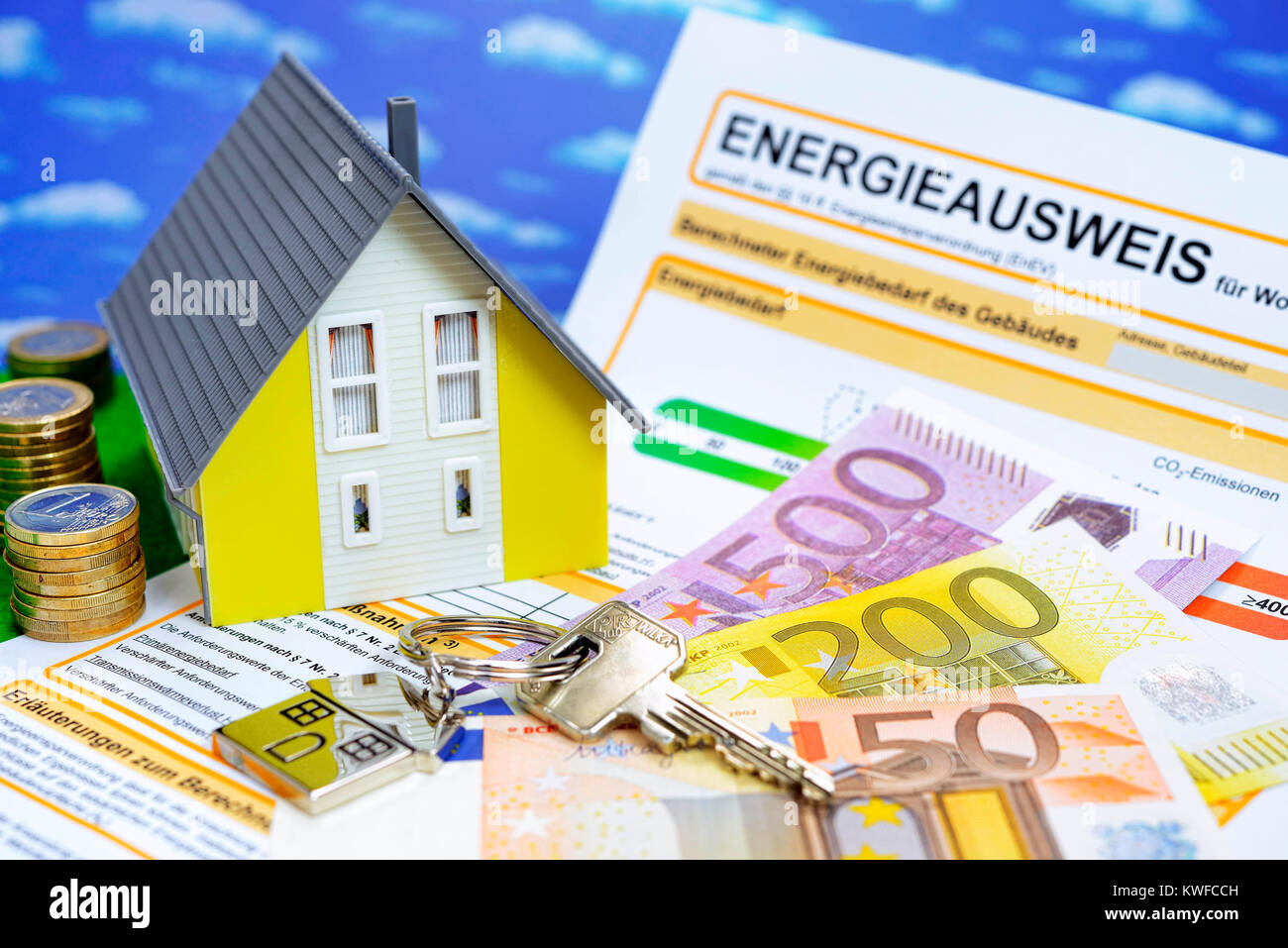 Miniature house and energy identity card, Miniaturhaus und Energieausweis Stock Photo