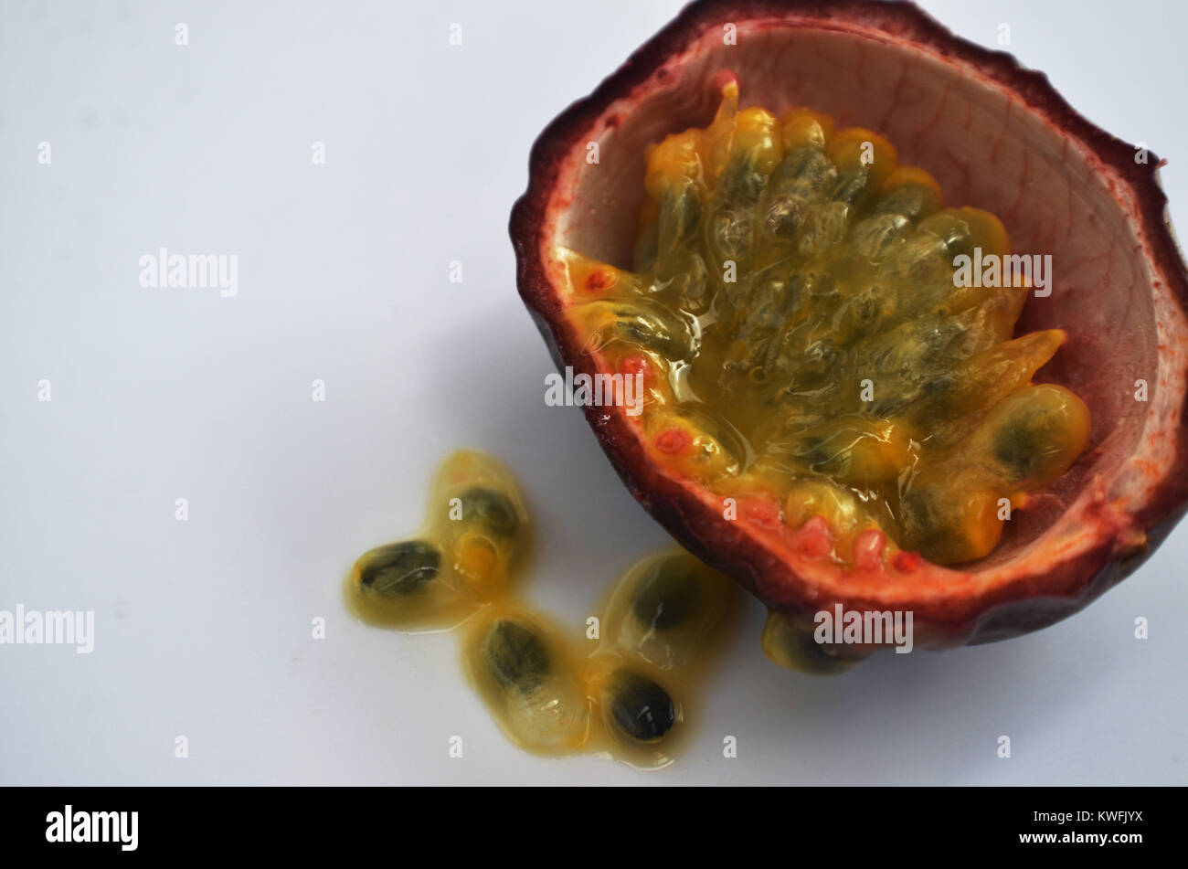 Passion fruit cut in half close up Stock Photo Alamy