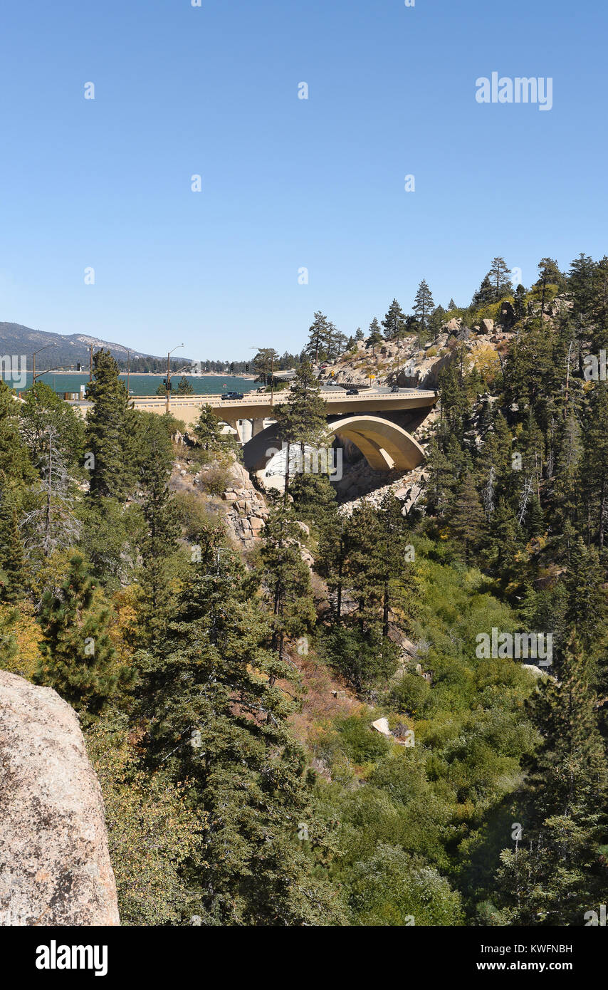 Highway 18 bridge at the Bear Valley Dam in Big Bear California. Big Bear Lake in the background. Stock Photo