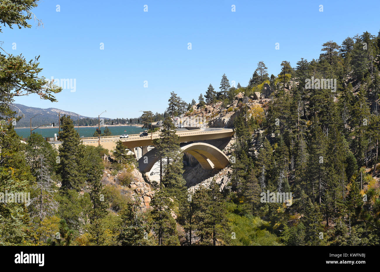 Highway 18 bridge at the Bear Valley Dam in Big Bear California. Big Bear Lake in the background. Stock Photo