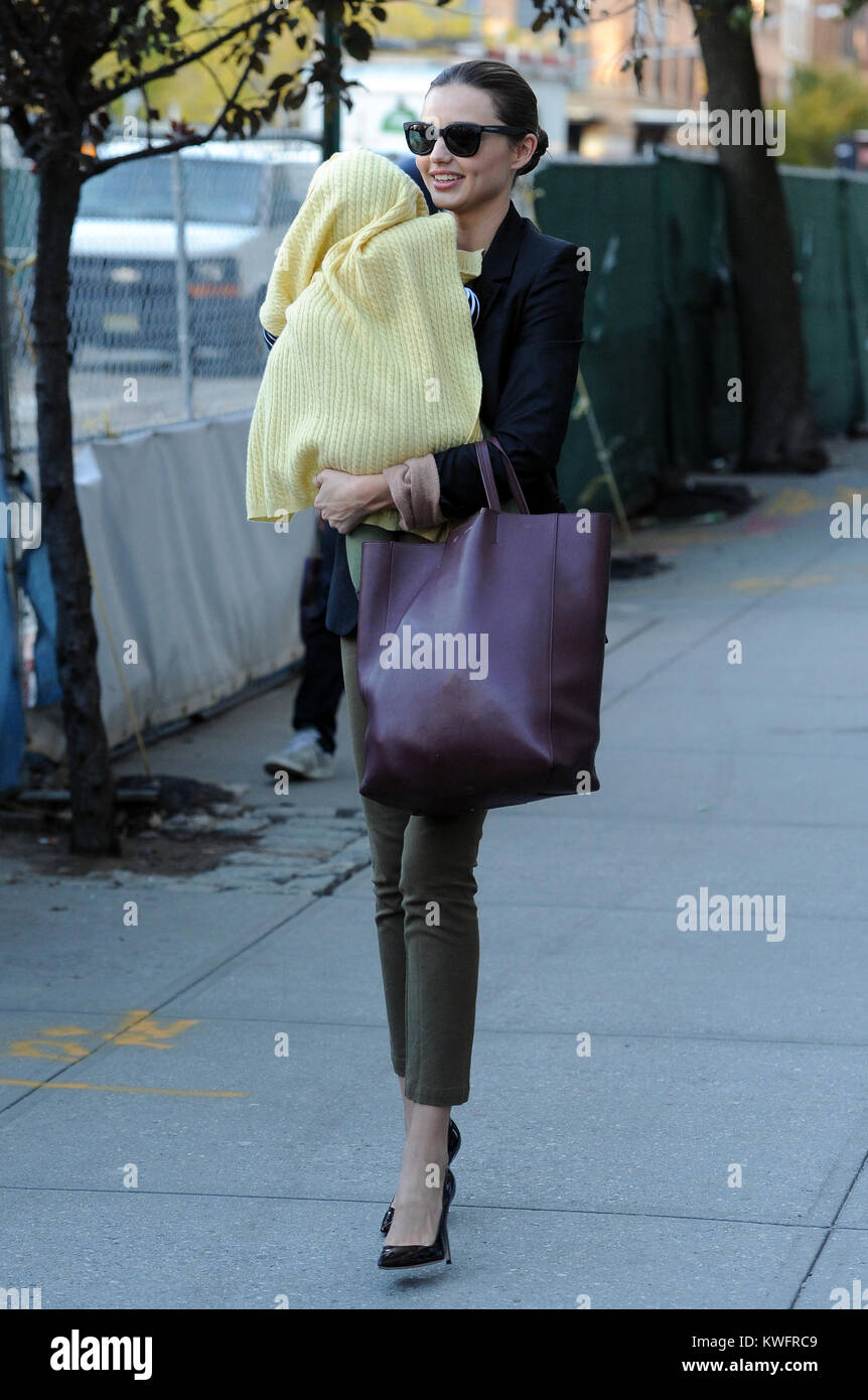 New York Ny November 05 Model Miranda Kerr Exits From Lunch At A Cafe In Tribeca Holding A Friends Kid With Hopes Of Fooling The Paparazzi Orlando Bloom Exited Shortly After