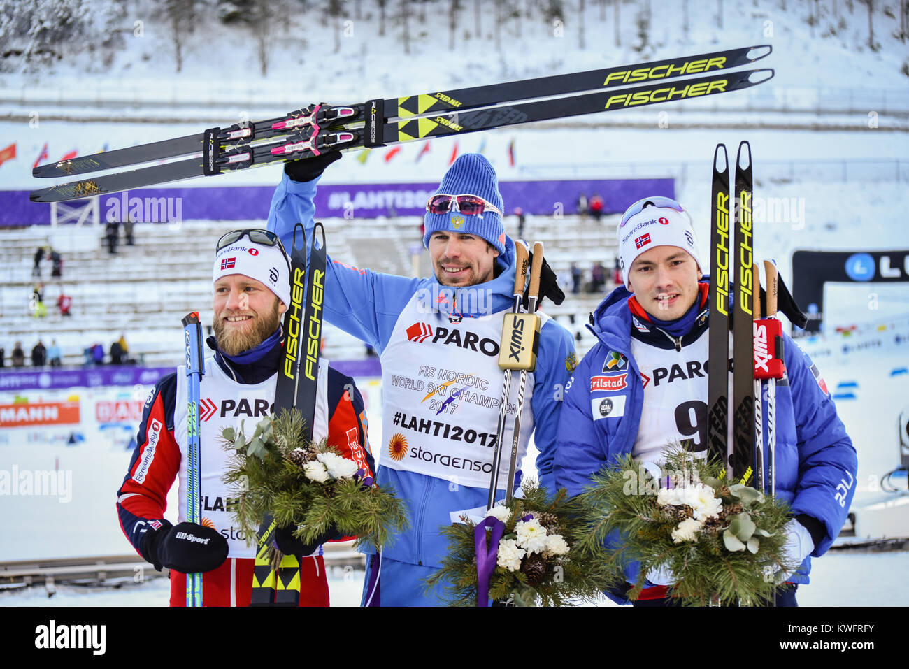 Podium, 30-k skiathlon, Lahti 2017. L-R: Martin Johnsrud Sundby (NOR, 2nd); Sergey Ustiugov (RUS, 1st); Finn Haagen Krogh (NOR, 3rd) Stock Photo