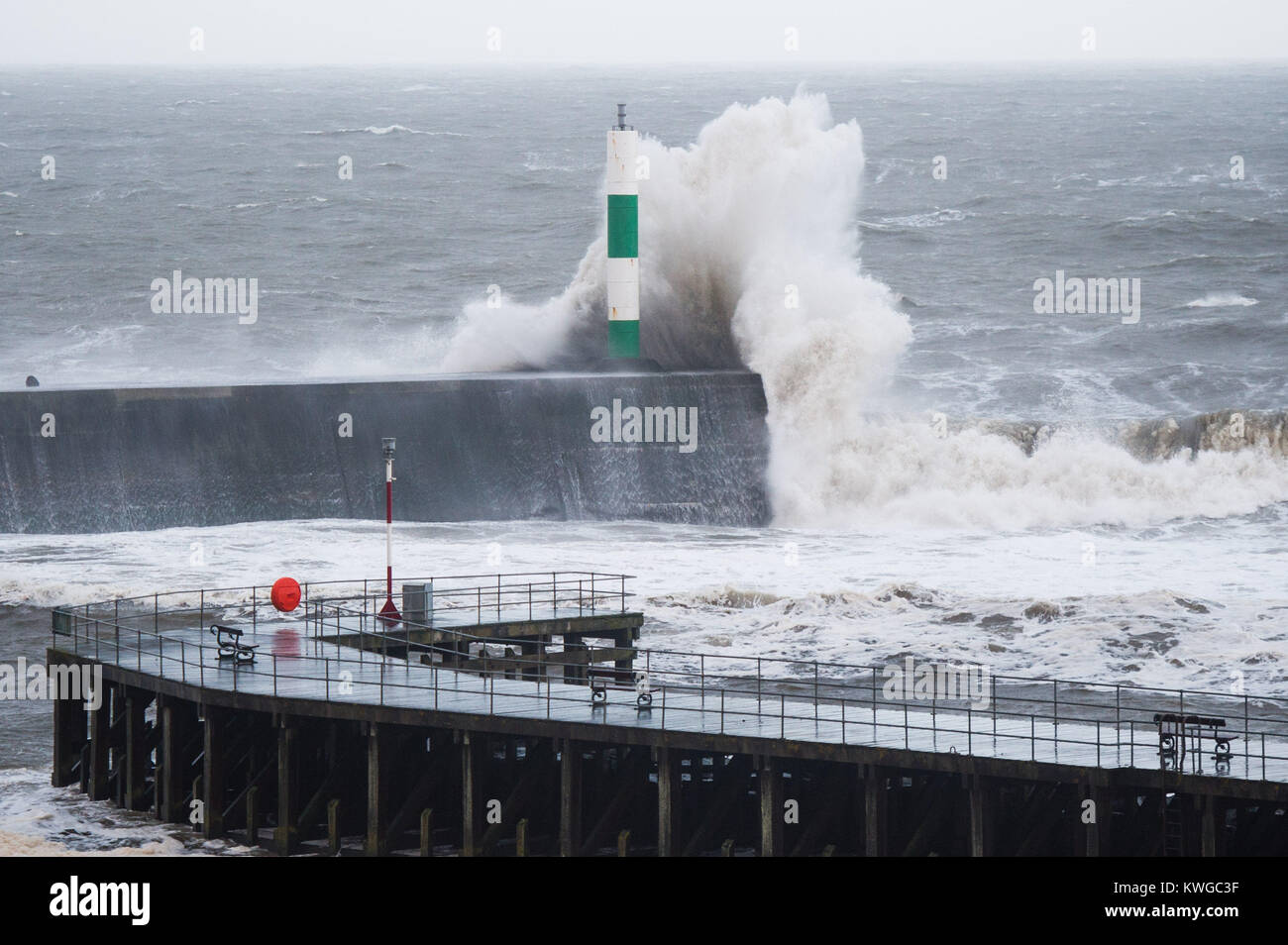 Aberystwyth Wales UK, Tuesday 03 January 2018 UK Weather : Storm Eleanor, the fifth named storm of the winter, hits Aberystwyth Wales, with westerly winds gusting up to 80mph bringing huge waves crashing against the sea defences at high tide in the early morning Yellow warnings for wind and flooding have been issued by the Met Office for the whole of England and wales, with the risk of damage and disruption greatest on the western shores of the country photo Credit: Keith Morris/Alamy Live News Credit: keith morris/Alamy Live News Stock Photo