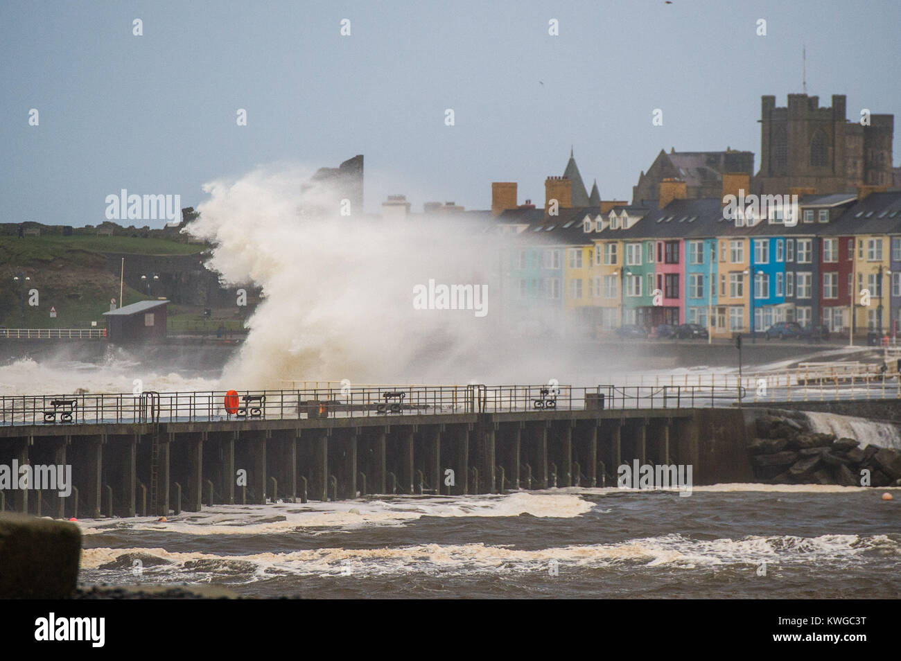 Aberystwyth Wales UK, Tuesday 03 January 2018 UK Weather : Storm Eleanor, the fifth named storm of the winter, hits Aberystwyth Wales, with westerly winds gusting up to 80mph bringing huge waves crashing against the sea defences and the seafront houses at high tide in the early morning Yellow warnings for wind and flooding have been issued by the Met Office for the whole of England and wales, with the risk of damage and disruption greatest on the western shores of the country photo Credit: Keith Morris/Alamy Live News Credit: keith morris/Alamy Live News Stock Photo
