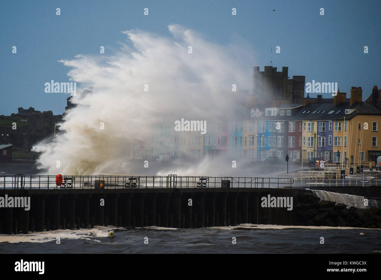 Aberystwyth Wales UK, Tuesday 03 January 2018 UK Weather : Storm Eleanor, the fifth named storm of the winter, hits Aberystwyth Wales, with westerly winds gusting up to 80mph bringing huge waves crashing against the sea defences and the seafront houses at high tide in the early morning Yellow warnings for wind and flooding have been issued by the Met Office for the whole of England and wales, with the risk of damage and disruption greatest on the western shores of the country photo Credit: Keith Morris/Alamy Live News Credit: keith morris/Alamy Live News Stock Photo