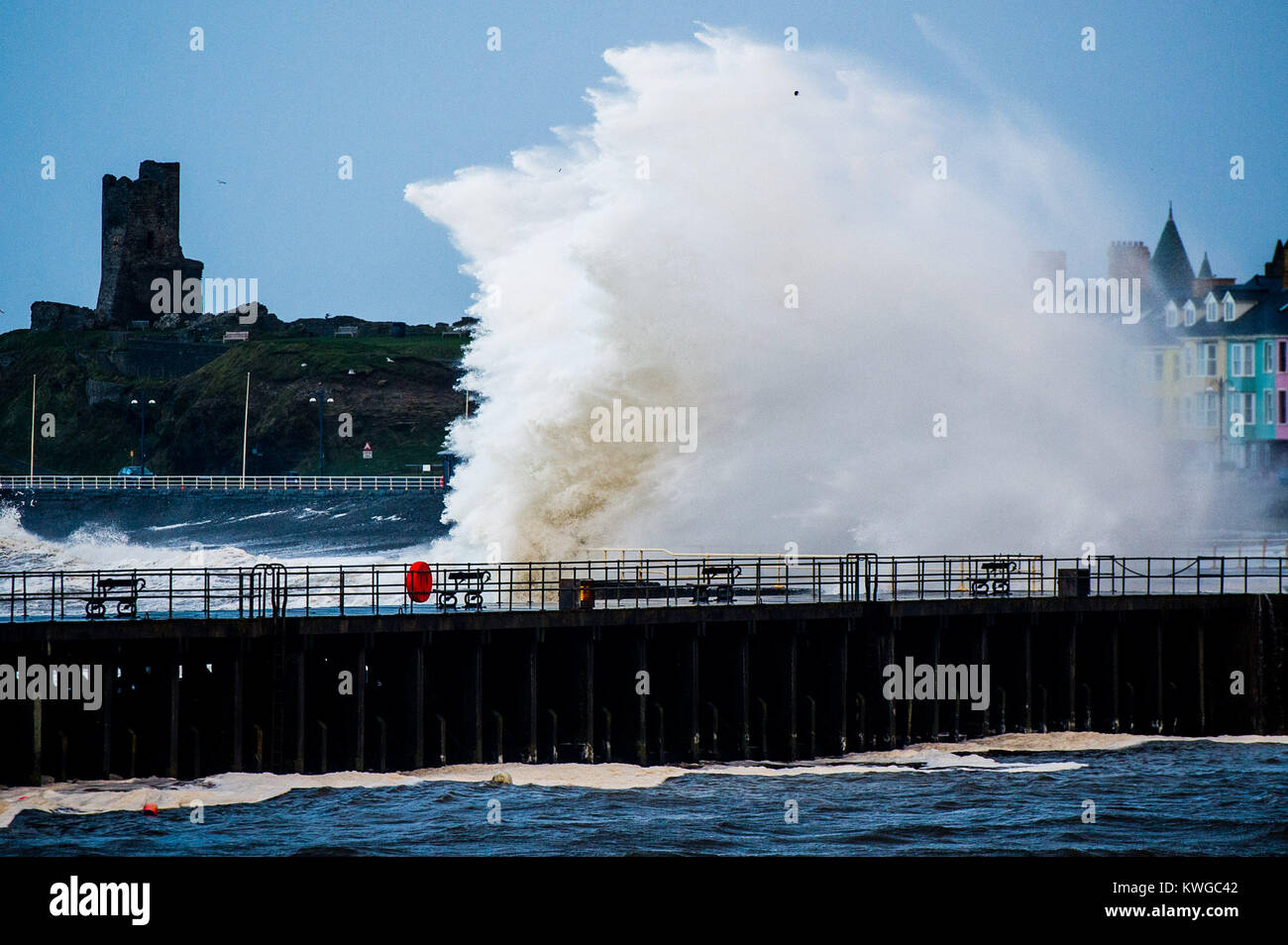 Aberystwyth Wales UK, Tuesday 03 January 2018 UK Weather : Storm Eleanor, the fifth named storm of the winter, hits Aberystwyth Wales, with westerly winds gusting up to 80mph bringing huge waves crashing against the sea defences and the seafront houses at high tide in the early morning Yellow warnings for wind and flooding have been issued by the Met Office for the whole of England and wales, with the risk of damage and disruption greatest on the western shores of the country photo Credit: Keith Morris/Alamy Live News Credit: keith morris/Alamy Live News Stock Photo